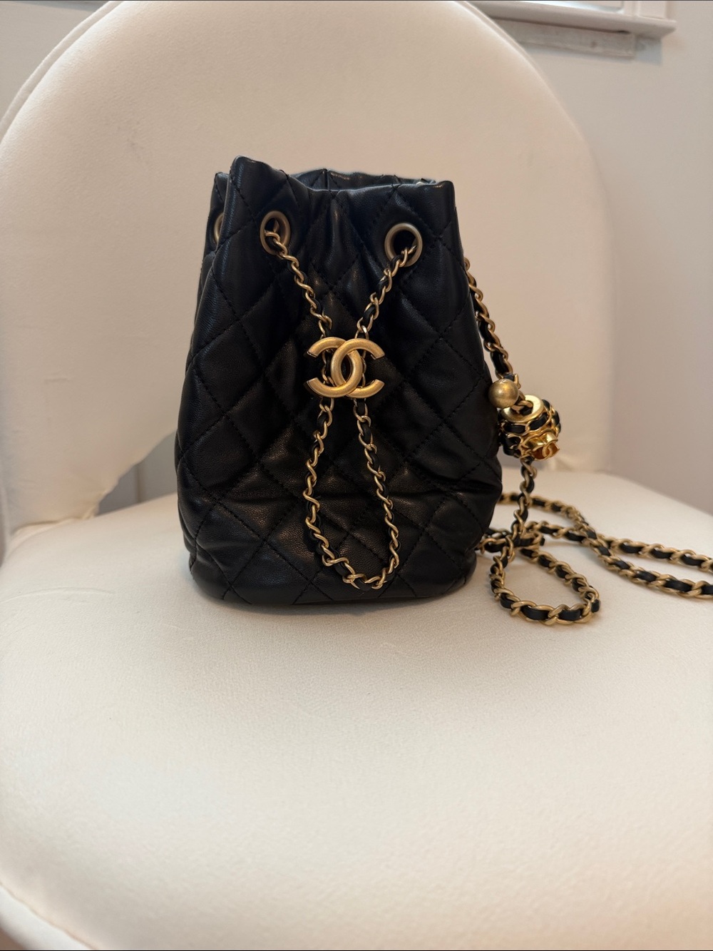CHANEL Black Quilted Lambskin Mini Drawstring Bucket Bag with Gold Hardware